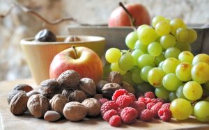 A variety of fruits and nuts on counter