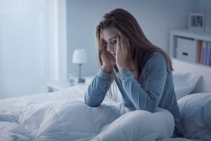 woman awake at night from insomnia