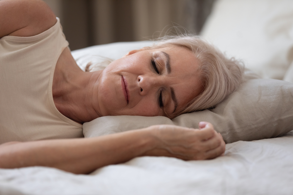 A woman sleeps after she found treatment for sleep apnea and insomnia.