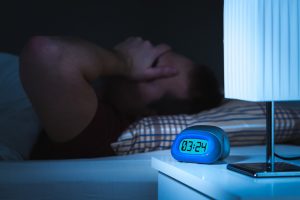 man having trouble sleeping