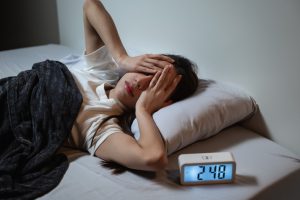 woman dealing with restless sleep - North Texas Sleep Solutions in Keller