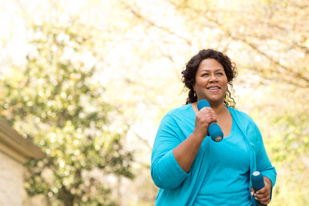 A woman is exercising as a natural sleep apnea remedy