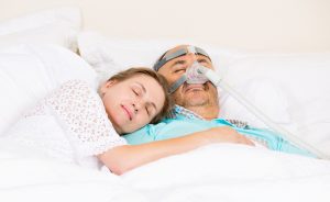 a couple enjoy sleeping together after sleep apnea misconceptions were cleared up